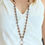 Thumbnail: Gold and charcoal glass beads long necklace