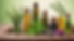realistic table with collection of colorful herbs and oil bottles.png