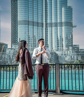 Couple by the lake below the Burj Khalifa