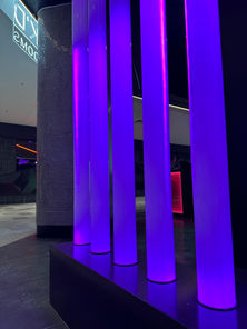 Decorative purple LED lighting pillars located in a escape room venue.