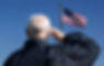 View of a veteran saluting the flag of t