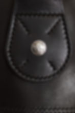 Thumbnail: Horween Dublin black leather chain hook with buffalo nickel in center.