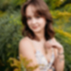 senior girl in yellow flower field at Kathryn Albertson park in Boise, Idaho