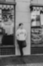 Senior boy standing in front of the Egyptian theater in Boise, Idaho