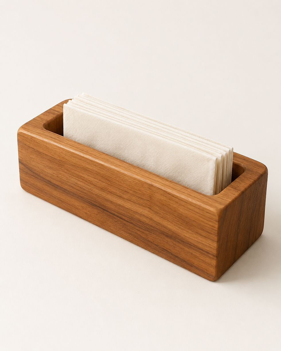 Concept rendering of Fold Napkin Rest in softly matte honey-brown teak against an ivory background, holding a small stack of ivory napkins.