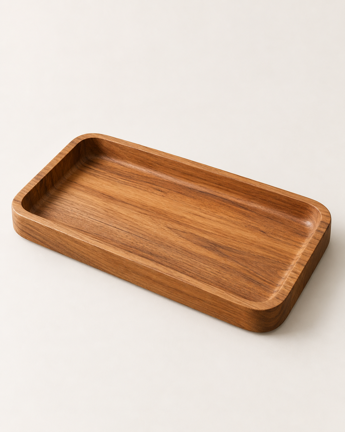 Concept rendering of Dune Valet Tray in softly matte honey-brown teak against an ivory background.