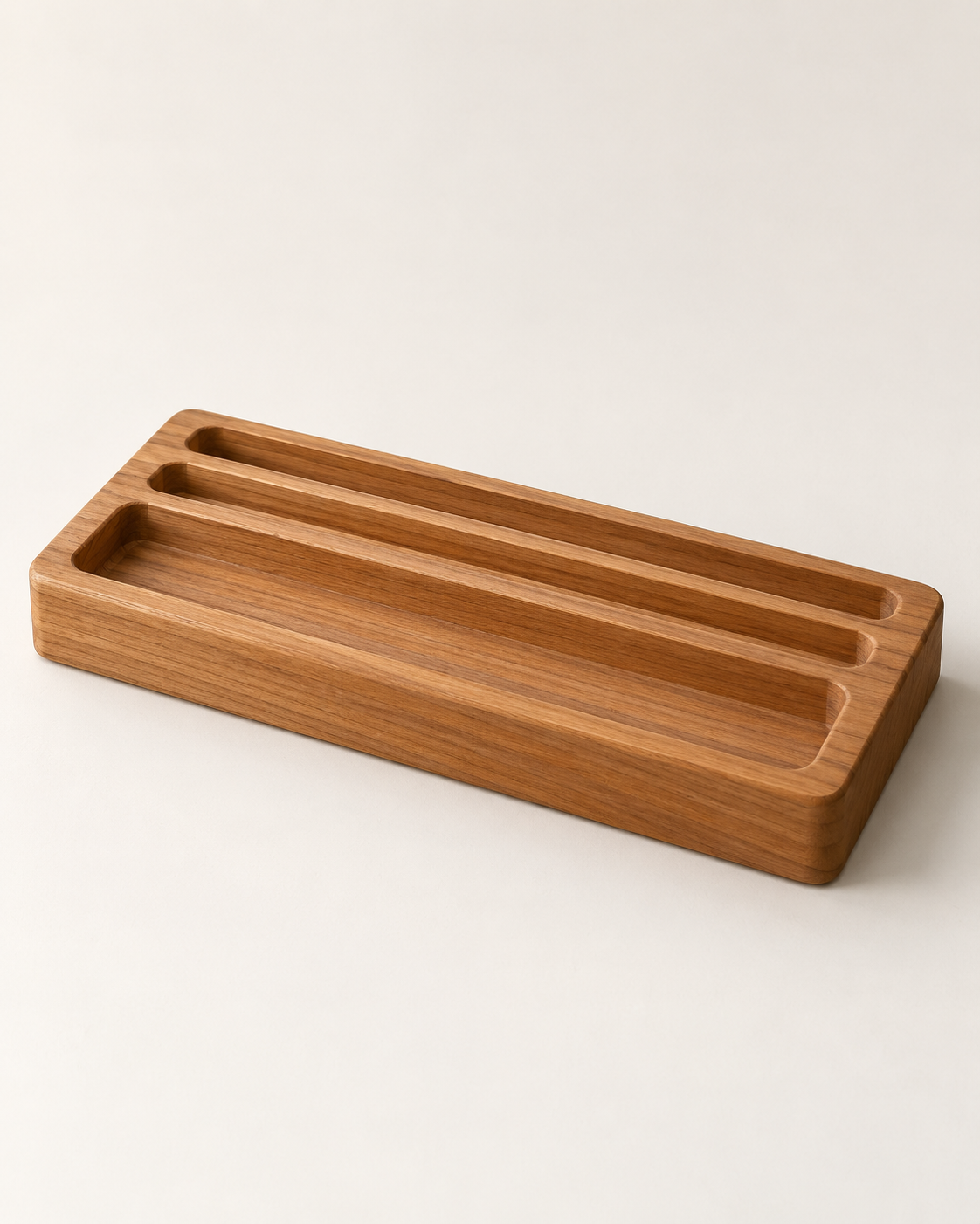 Concept rendering of Line Desk Organizer in softly matte honey-brown teak against an ivory background.