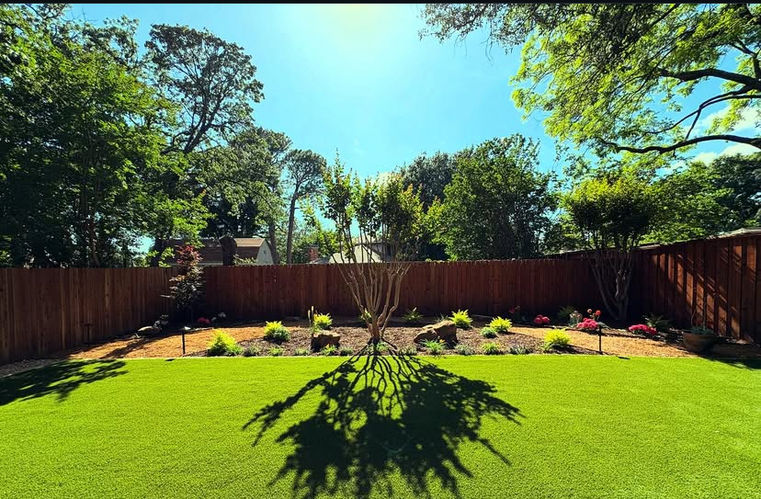 Backyard with crape myrtle centerpiece, boulders, decomposed granite bed, landscape lighting and artificial turf in Dallas