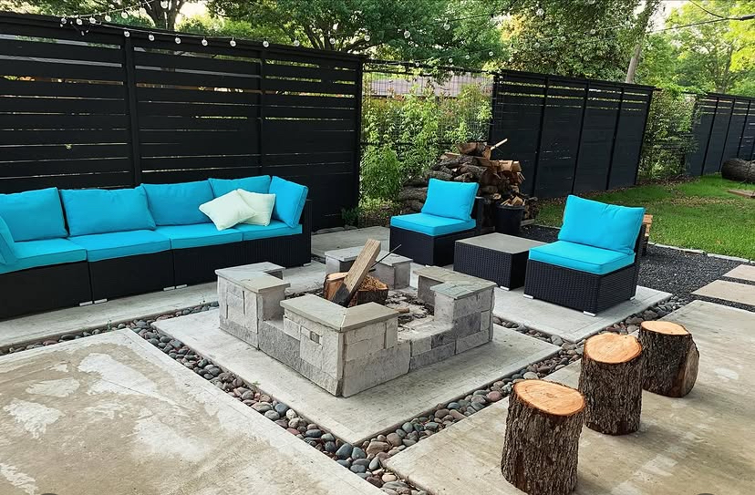 Fire pit patio with a privacy screen by Grayscape Landscape & Design, landscaper in McKinney, TX. Landscaper Near Me.