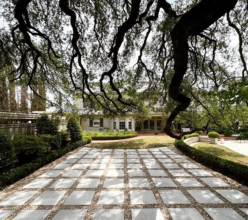 Paver grid patio under a mature oak by Grayscape Landscape & Design, landscaper in Lakewood, TX. Landscaper Near Me.