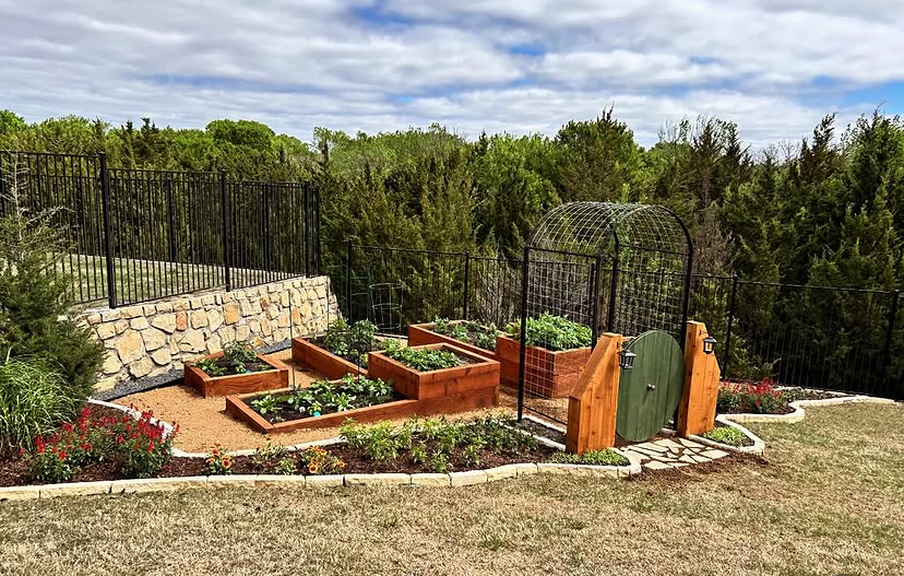 Raised garden beds and a stone wall by Grayscape Landscape & Design, landscaper in Plano, TX. Landscaper Near Me.