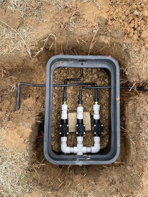 Irrigation valves in a valve box by Grayscape Landscape & Design, landscaper in North Dallas, TX. Landscaper Near Me.