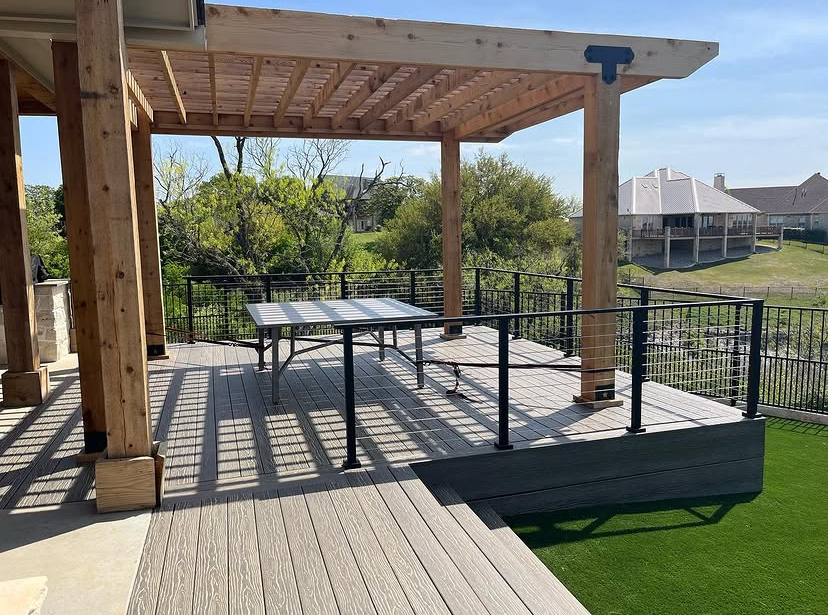 Cedar pergola over a cable-rail deck by Grayscape Landscape & Design, landscaper in Frisco, TX. Landscaper Near Me.
