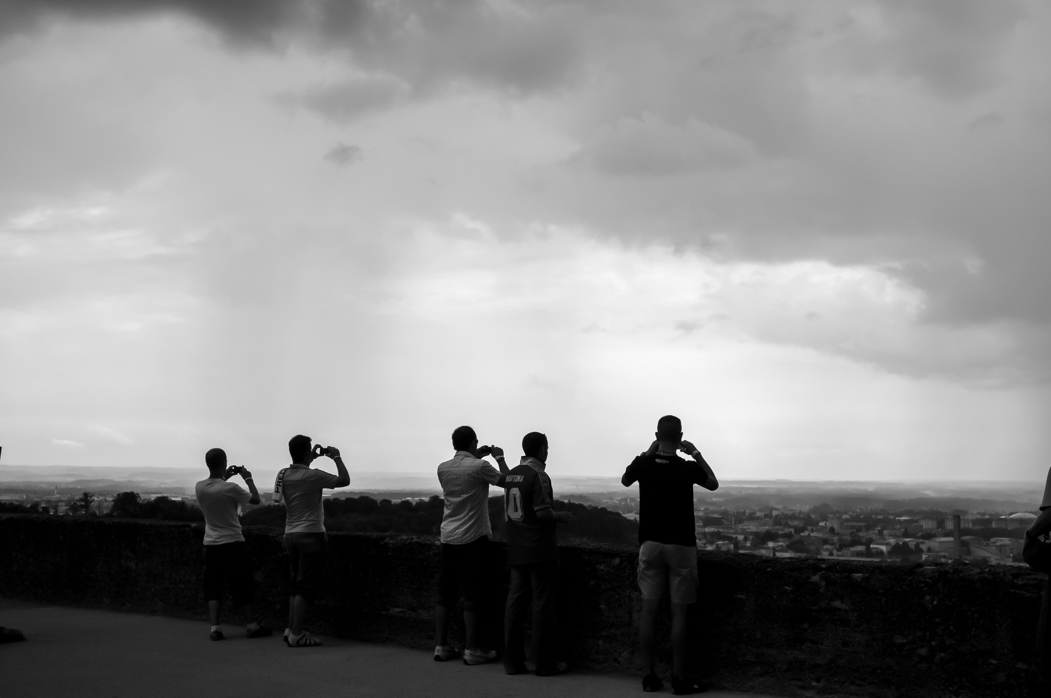 people taking photos, sky, cameras in hands