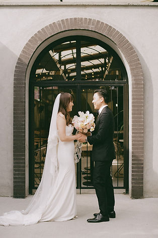 Newlyweds together outside of Fonda Fora restaurant, Calgary