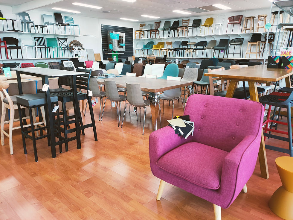Wide angle view of a modern indoor seating area with sofas and cushions
