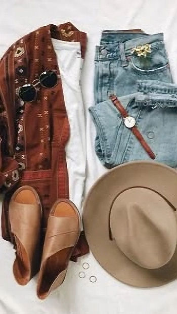 Casual outfit flat lay: brown sandals, beige hat, sunglasses, watch, and rings with blue jeans, white tee, and patterned red shawl.