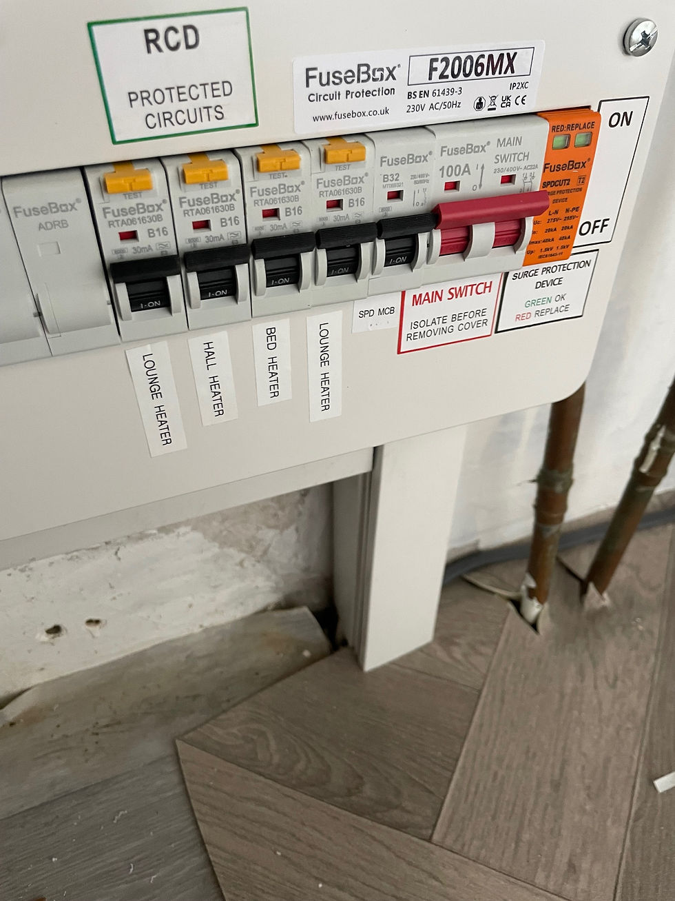 Close-up view of an electrician examining a circuit board