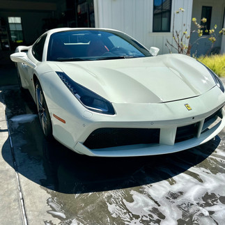 Ferrari 488 front view after wash in front of garage