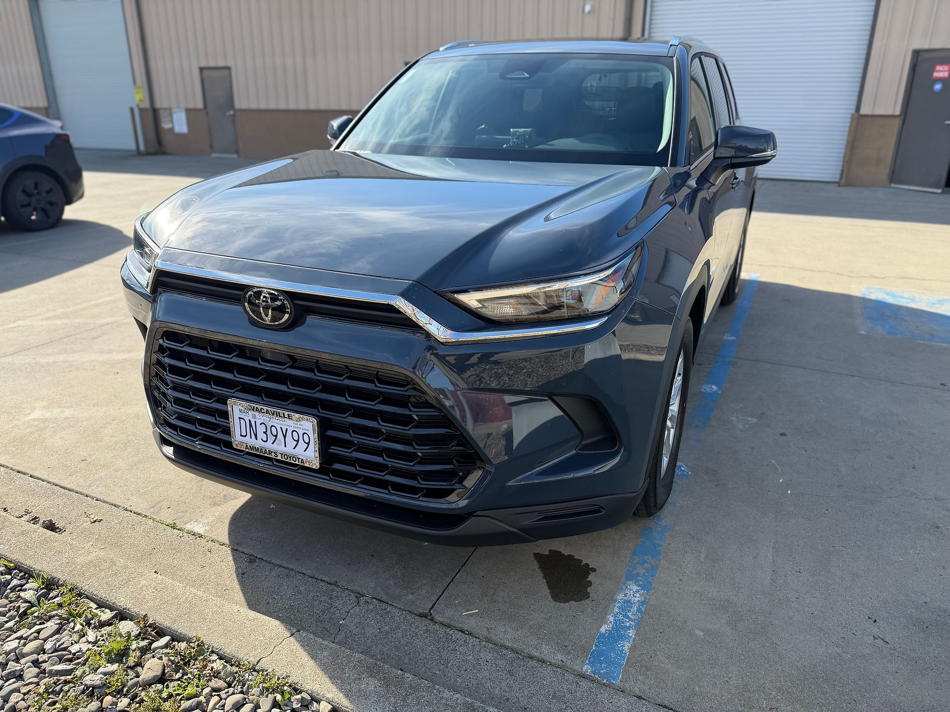 Toyota Grand Highlander after getting a full front PPF wrap and coating outside our shop