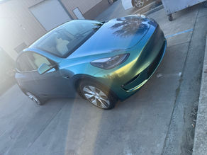 Jungle green paint protection film (PPF) full wrap on Tesla Model Y by Robust Paint Protection & Auto Detailing here in Napa outside our shop