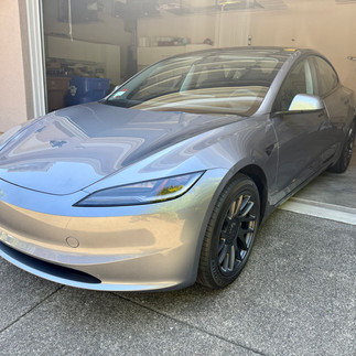 Front side view of ceramic coated Tesla Model 3 in customer’s garage in Napa installed by Robust Paint Protection & Auto Detailing