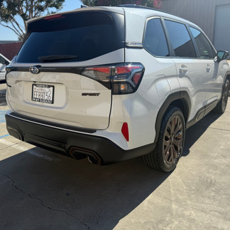Rear side view of Subaru Forester after Partial Front Wrap and 5-Year Coating outside our Robust Shop in Napa