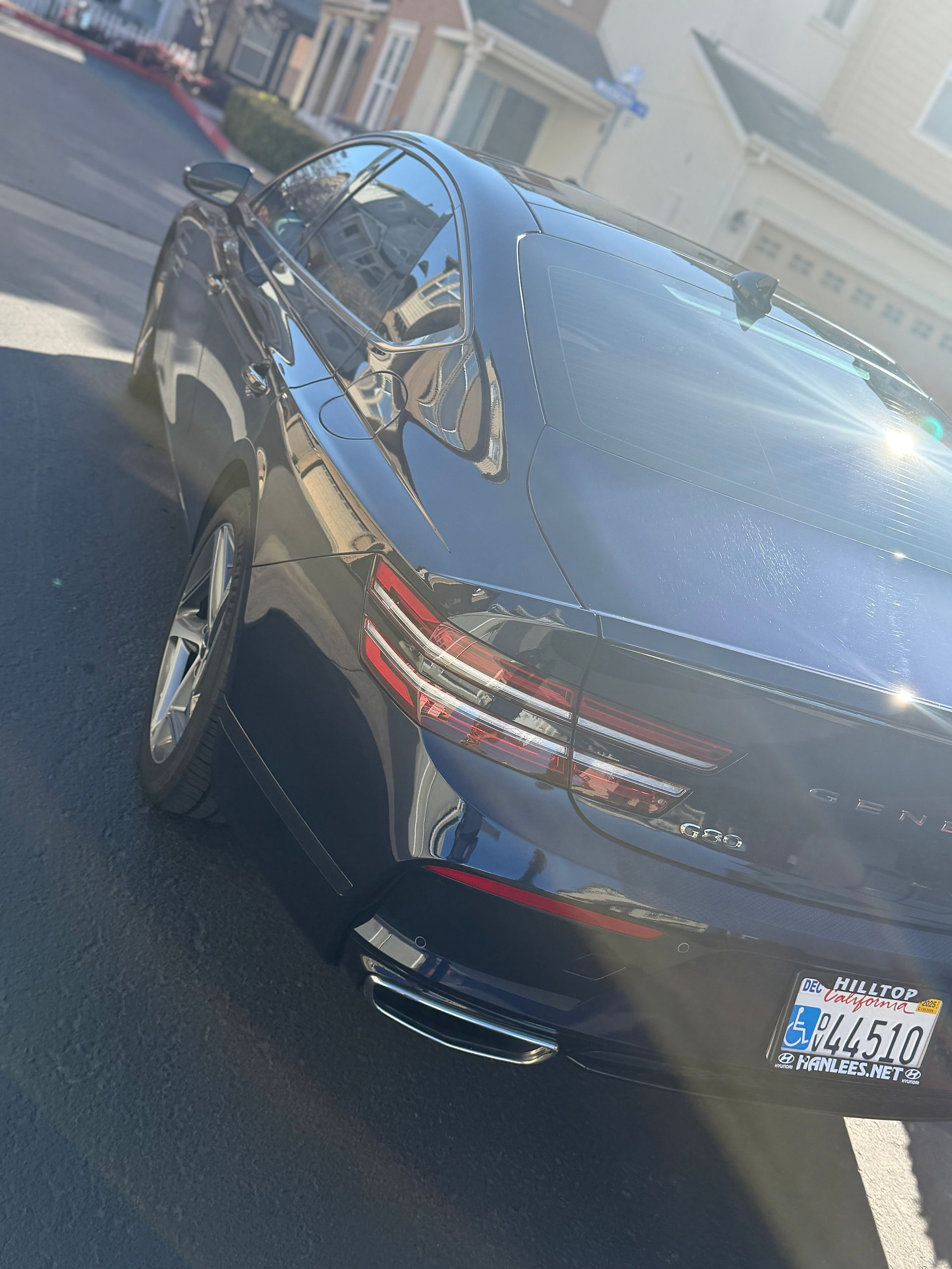 Rear side view of PPF & Coated Genesis G80 by Robust Paint Protection & Auto Detailing in Fairfield