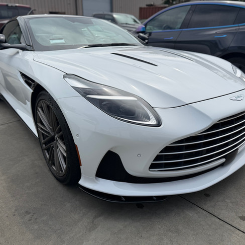 front bumper showing ceramic paint protection film installed on Aston Martin DB12