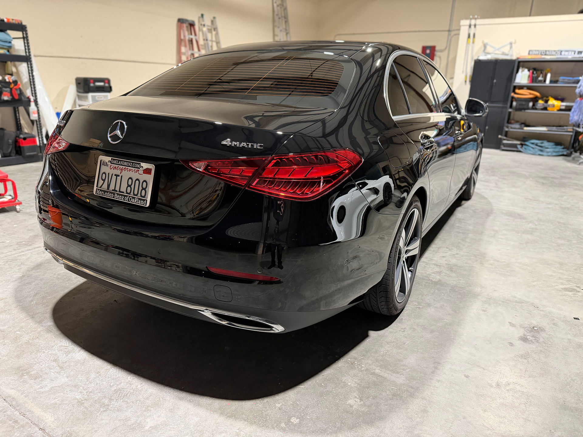 Rear passenger side view of Mercedes C300 after paint correction and swirls removal after bad wash