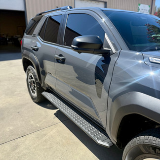 Passenger side view of Ceramic Paint Protection Film (PPF) and Ceramic Coating on Toyota 4Runner showing glossy coating outside our shop