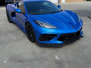 Blue C8 Corvette with full front and side skirt PPF wrap outside our Napa Shop