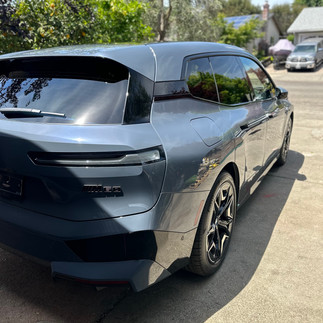 Shiny BMW IX M60 New Coated Side View New Car