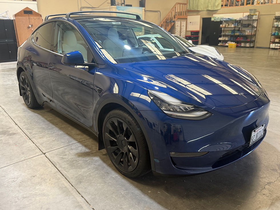 Front view of blue Tesla Model Y at Robust Shop after two-step paint correction