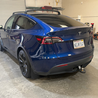 Rear driver side view after two-step paint correction on blue Tesla Model Y at Robust shop in Napa