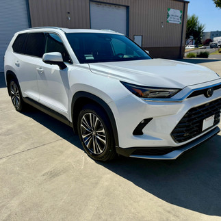 Front view coating install on new white Toyota Grand highlander in napa by Sonoma customer outside Robust Shop
