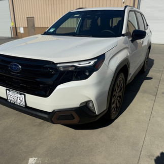 Front side view of Subaru Forester after Partial Front Wrap and 5-Year Coating outside our shop