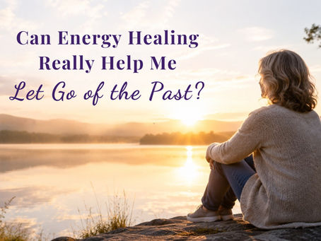 Woman sitting beside a peaceful lake at sunrise, reflecting on letting go of the past and moving forward with hope.