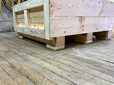 Open-frame wood shipping base on skids