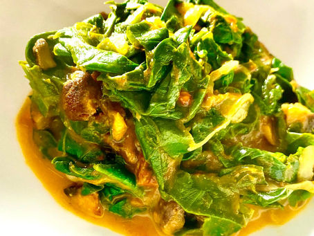 Spinach with a curry tomato salsa