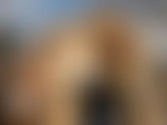 A house under construction in Texas, featuring scaffolding and a ladder, showcasing room additions in progress.