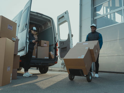 A man unloading cargo carefully