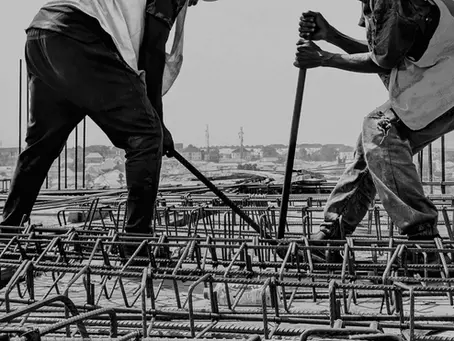 Experienced builders in Victoria, Texas working on rebar framework at a construction site