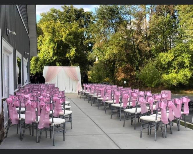 charvari chairs with pink sash on patio for outdoor ceremony in maryland 