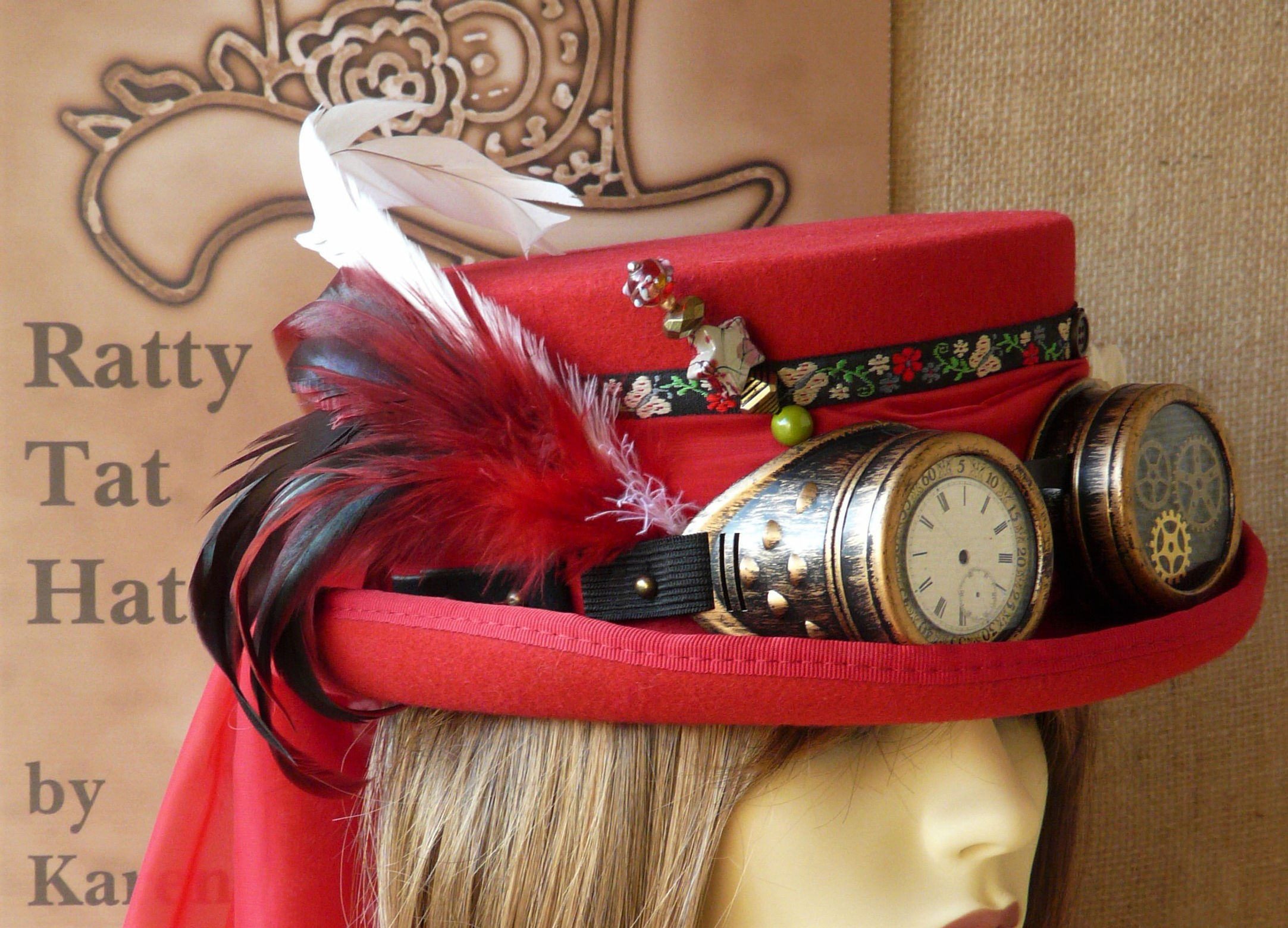 Woman's scarlet red Deadman or low crown Steampunk top hat with goggles