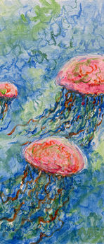 Red jellyfish swimming in blue and green water