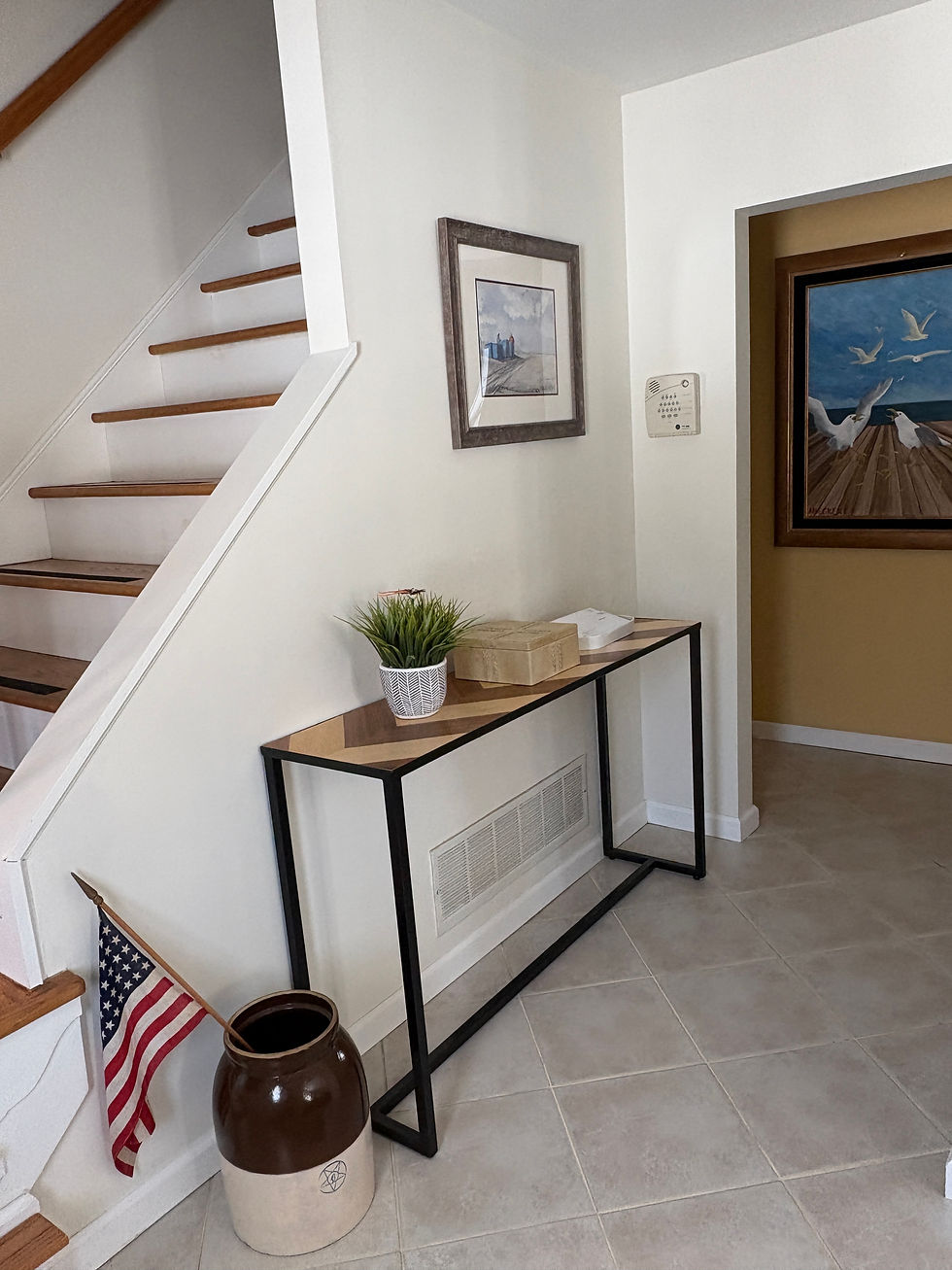 The small foyer in our home. Joe's painting is just perfect here.