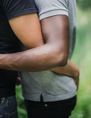 male couple embrace