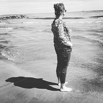 A picture of Patricia, a long covid Ireland member, looking out over the sea