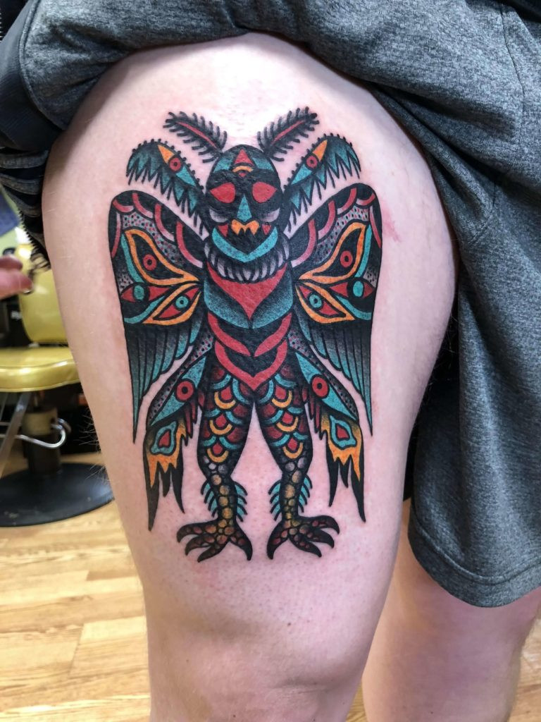 mothman tattoo on thigh